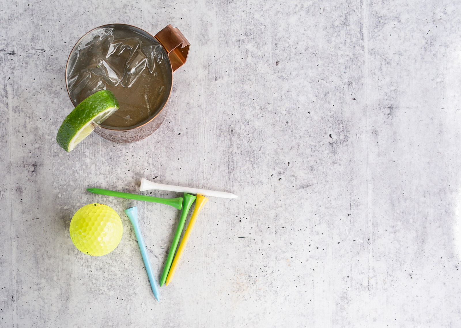 drink with golf ball and tees background